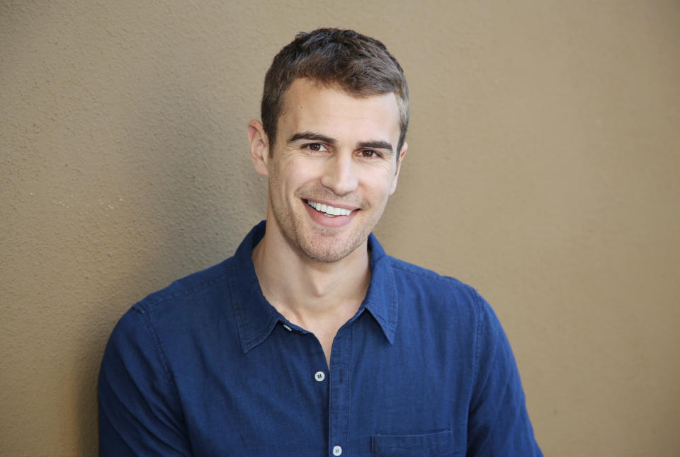 In this Saturday, March 8, 2014 photo, actor Theo James poses for a photo in Beverly Hills, Calif. The soulful Brit James, the star of the buzzed about “Divergent,” is being set up as Hollywood next heartthrob. The film adaptation of Veronica Roth’s sci-fi best-seller hits theaters on Friday, March 21, 2014. (Photo by Annie I. Bang /Invision/AP)