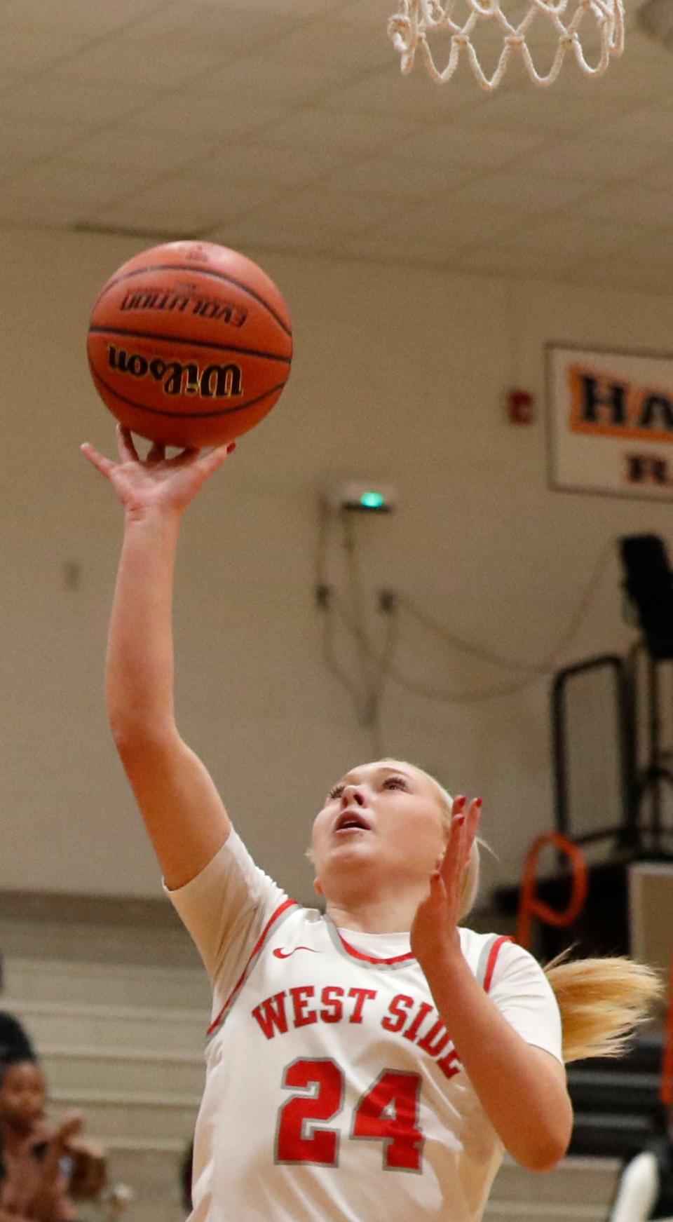 West Lafayette Red Devils Vivian Huston (24) shoots the ball during the IU Health Hoops Classic Girl’s Basketball Championship against the Rensselaer Central Bombers, Saturday, Nov. 18, 2023, at Harrison High School in West Lafayette, Ind. Rensselaer Central Bombers won 58-53.