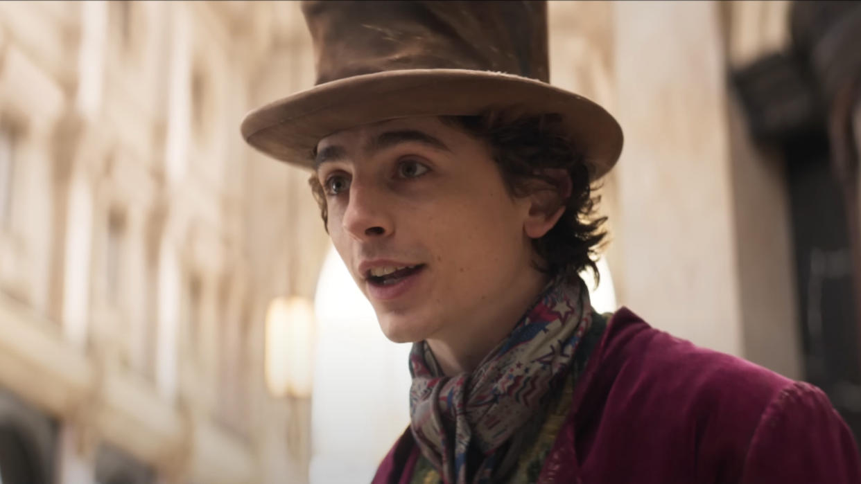  Timothée Chalamet giving a speech in a square in Wonka. 