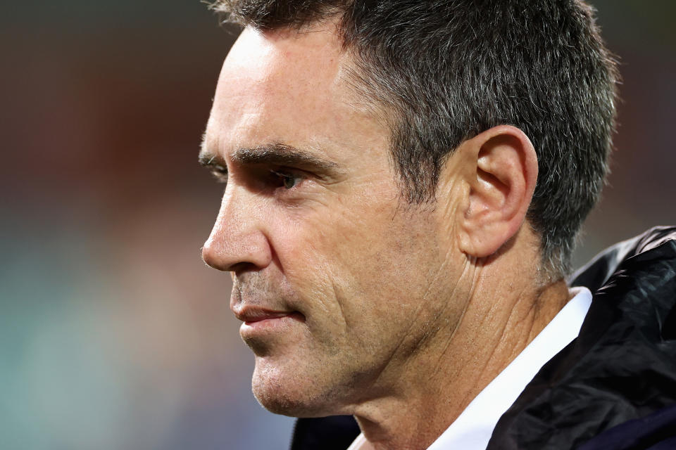 Blues coach Brad Fittler watching on.