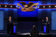 President Donald Trump, left, and Democratic presidential candidate former Vice President Joe Biden, right, with moderator Chris Wallace, center, of Fox News during the first presidential debate Tuesday, Sept. 29, 2020, at Case Western University and Cleveland Clinic, in Cleveland, Ohio. (AP Photo/Patrick Semansky)