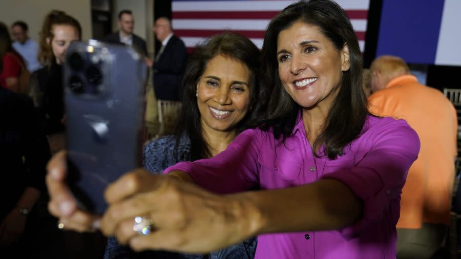 <em>Republican presidential candidate Nikki Haley poses for a photo with Rajshri Agarwal, of Ames, Iowa, left, during a town hall campaign event, Wednesday, May 17, 2023, in Ankeny, Iowa. (AP Photo/Charlie Neibergall)</em>