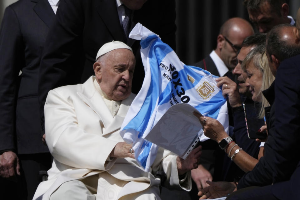 Pope Francis meets faithful at the end of his weekly general audience in St. Peter's Square, at the Vatican, Wednesday, April 24, 2024. (AP Photo/Alessandra Tarantino)