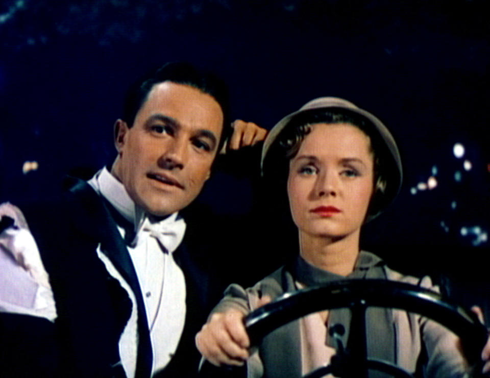 Gene and Debbie in formal attire sitting in a car