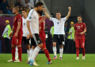 German forward Lukas Podolski (2ndR) celebrates at the end of the Euro 2012 championships football match Germany vs Portugal on June 9, 2012 at the Arena Lviv. Germany won 1-0. AFP PHOTO / JEFF PACHOUDJEFF PACHOUD/AFP/GettyImages