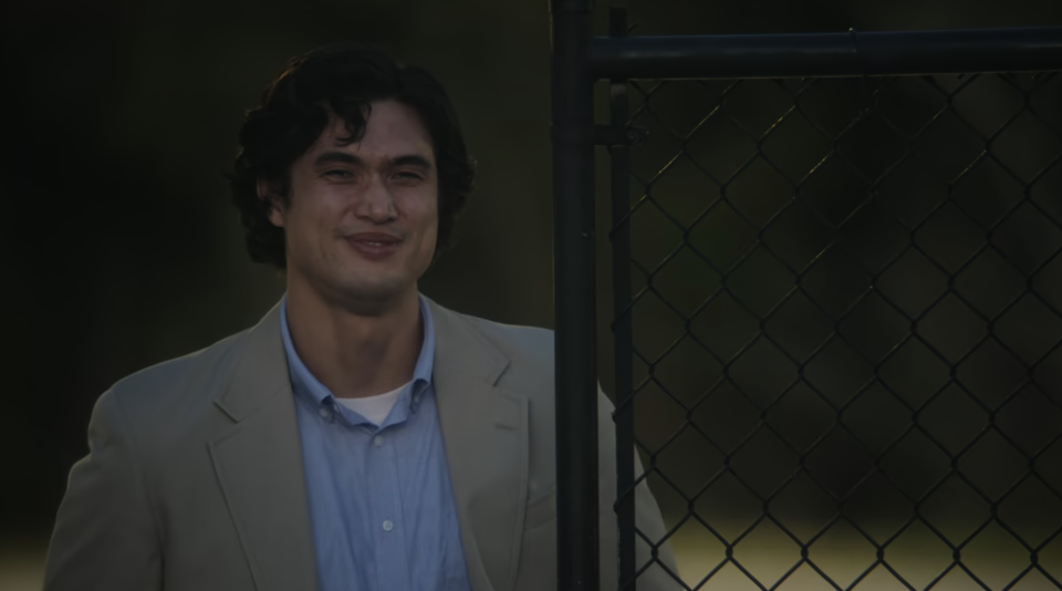 Joe slightly smiling in a scene from "May December"