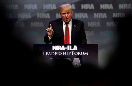 Donald Trump addresses members of the National Rifle Association's during their NRA-ILA Leadership Forum during their annual meeting in Louisville, Kentucky, May 20, 2016. REUTERS/John Sommers II