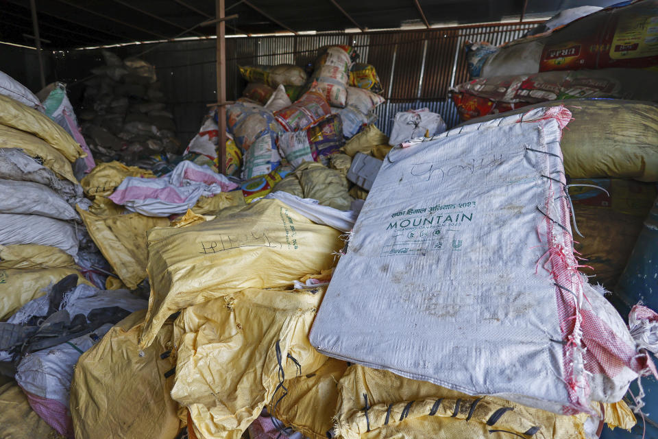 Sacks of garbage collected en route Mount Everest are piled before recycling at a facility operated by Agni Ventures, an agency that manages recyclable waste, in Kathmandu, Nepal, Monday, June 24, 2024. The highest camp on the world's tallest mountain is littered with garbage that is going to take years to clean up, according to a Sherpa who led a team that worked to clear trash and dig up dead bodies frozen for years near Mount Everest's peak. (AP Photo/Sanjog Manandhar)