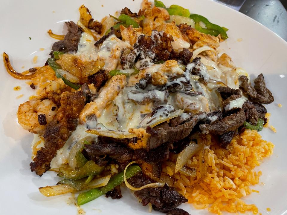 The Loco ACP Texas at Don Chuy's Fresh Mex and Cantina is made with chunks of grilled chicken, steak and shrimp, served over rice and doused in queso.