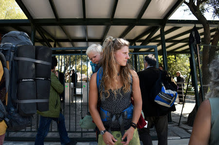 A tourist stands outside a closed entrance of the Acropolis' archaeological site in Athens, Greece, October 11, 2018. REUTERS/Michalis Karagiannis