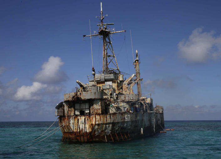 A dilapidated Philippine Navy ship LT 57 (Sierra Madre) with Philippine troops deployed on board is anchored off Second Thomas Shoal, locally known as Ayungin Shoal, Sunday, March 30, 2014 off South China Sea. On Saturday, China Coast Guard attempted to block the Philippine government vessel AM700 carrying fresh troops and supplies, but the latter successfully managed to docked beside the ship to replace troops who were deployed for five months. (AP Photo/Bullit Marquez)