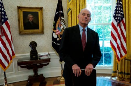 FILE PHOTO - White House Chief of Staff John Kelly stands close by as U.S. President Donald Trump meets with former U.S. Secretary of State Henry Kissinger in the Oval Office of the White House in Washington, U.S., October 10, 2017.  REUTERS/Kevin Lamarque