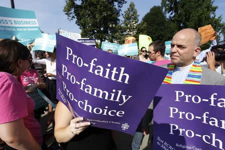 Pro-choice demonstrators rally outside the U.S. Supreme Court in Washington June 30, 2014. REUTERS/Jonathan Ernst