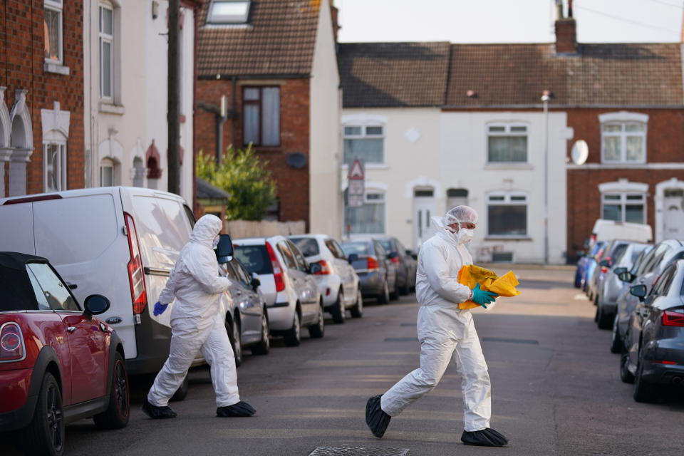 Forensic officers at the scene in Moore Street, Kingsley, Northampton following a discovery of a body in a rear garden. The remains are expected be taken to Leicester where they will be forensically examined by a Home Office pathologist but are believed to be that of a missing 42-year-old male. The investigation was mounted following the arrest of Fiona Beal, 48, at a hotel in Cumbria early on Wednesday morning. She has now been charged with murder. Picture date: Sunday March 20, 2022.