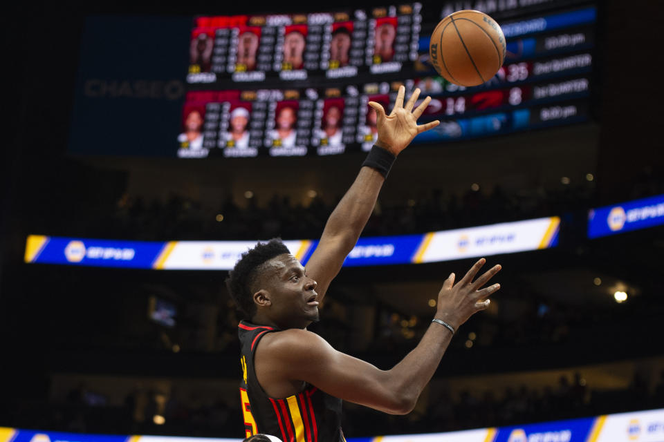 Atlanta Hawks center Clint Capela shoots, scoring against the Cleveland Cavaliers during the first half of an NBA basketball game Tuesday, March 28, 2023, in Atlanta. (AP Photo/Hakim Wright Sr.)