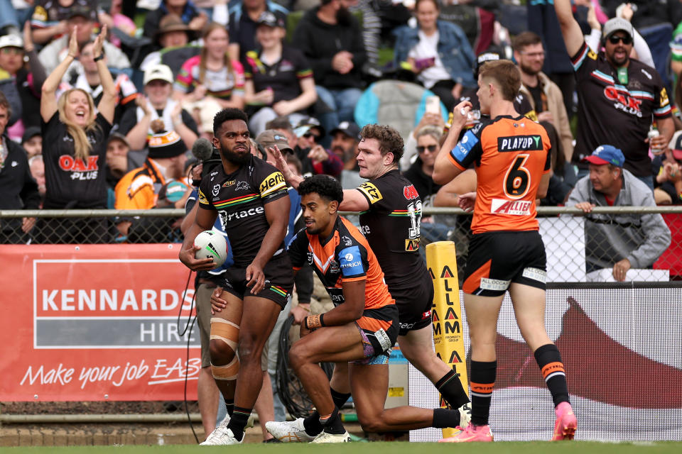 BATHURST, AUSTRALIA - APRIL 20:  Sunia Turuva of the Panthers celebrates with team mates after scoring a try during the round seven NRL match between Penrith Panthers and Wests Tigers at Carrington Park on April 20, 2024, in Bathurst, Australia. (Photo by Cameron Spencer/Getty Images)