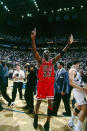 Michael Jordan raises six fingers to signify the Bulls' six titles won at the end of Game 6 of the 1998 NBA Finals. (Getty Images)