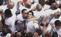 <p>Participants celebrate during the ‘Chupinazo’ (start rocket) to mark the kickoff at noon sharp of the San Fermin Festival, in front of the Town Hall of Pamplona, northern Spain, on July 6, 2018. (Photo: Jose Jordon/AFP/Getty Images) </p>