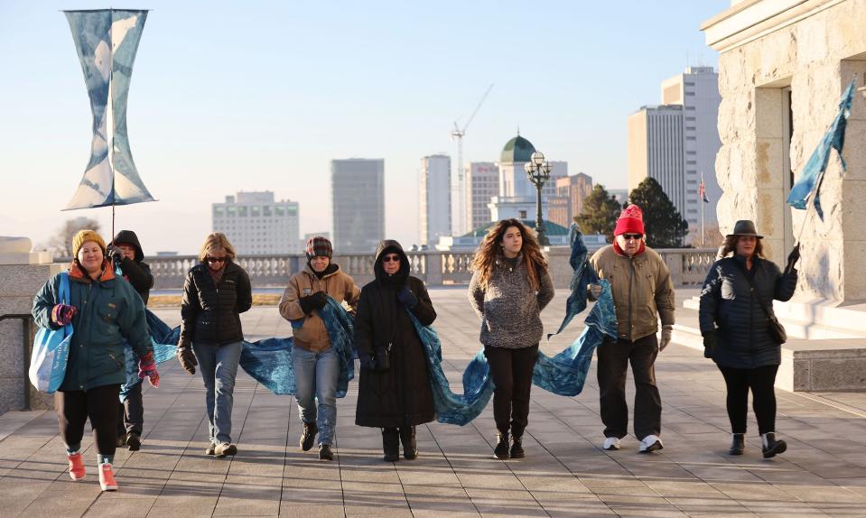 Members of the Great Salt Lake vigil group walk the grounds of the Capitol in Salt Lake City on Tuesday, Jan. 30, 2024. The group walks around the grounds every morning as part of its vigil. | Jeffrey D. Allred, Deseret News