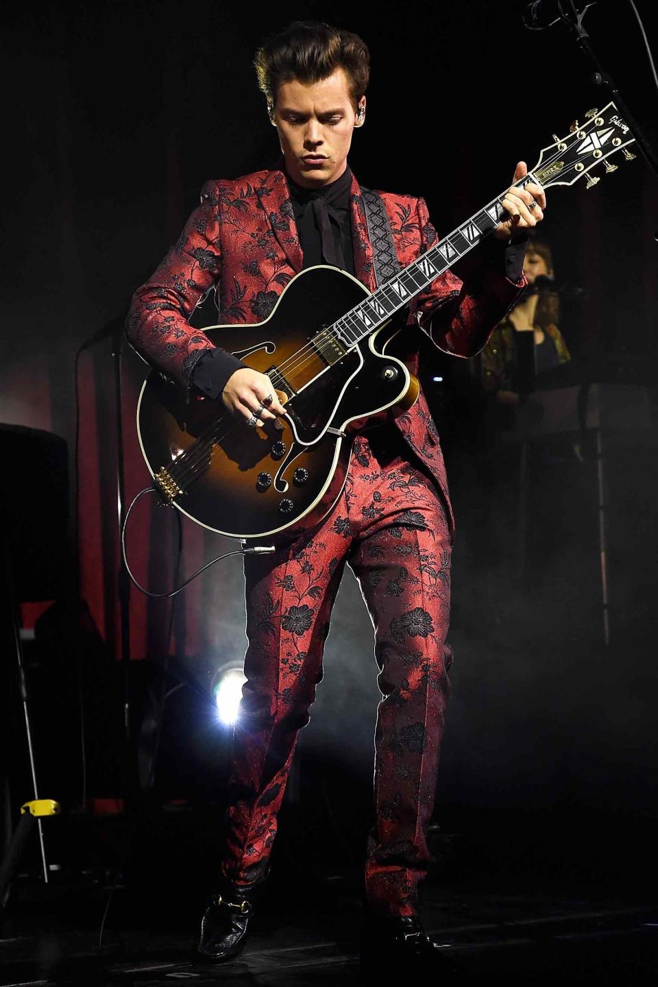 Performing at Radio City Music Hall in New York City in a floral brocade Gucci suit.