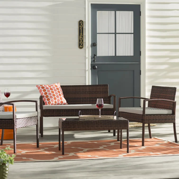 Carlyssa Wicker 4-Person Seating Group with Cushions. Image via Wayfair.