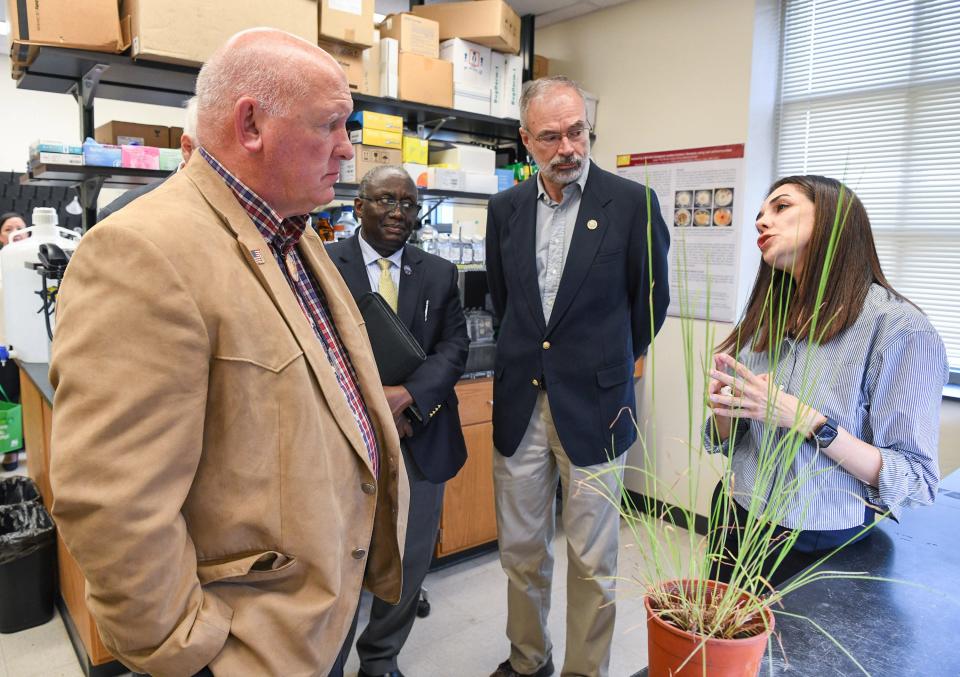 Rep. Glenn “GT” Thompson, R-Pa., left, Dr. Moses T. Kairo, dean of the UMES School of Agricultural and Natural Sciences, and Rep. Andy Harris, R-1st-Md.,  listen to Mozhgan Sepehri, research scientist, talk about saltwater intrusion during their visit to the University of Maryland Eastern Shore in Princess Anne on Friday, Aug. 11, 2023.