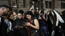 Anti-government protesters follow the results of the Senate's vote on a reform bill presented by Argentine President Javier Milei outside Congress in Buenos Aires, Argentina, Wednesday, June 12, 2024. The bill was approved in general and must now be debated article-by-article before being sent to the Lower House. (AP Photo/Rodrigo Abd)