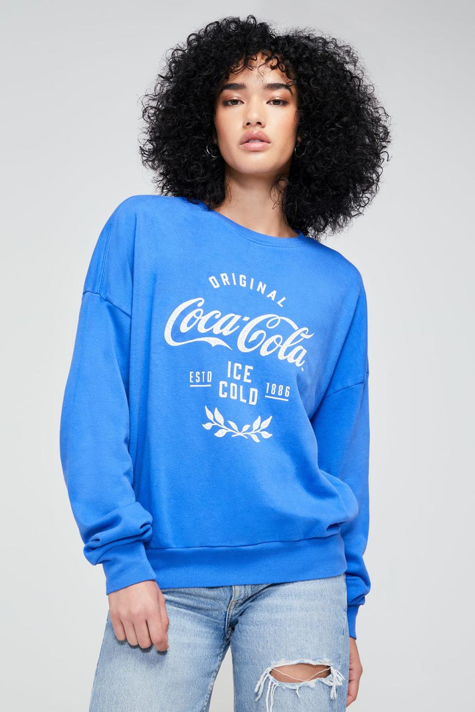 <p><a href="https://go.redirectingat.com?id=74968X1596630&url=https%3A%2F%2Fwww.wildfox.com%2Fproducts%2Foriginal-coca-cola-fifi-sweatshirt-dutch-blue%3Fvariant%3D40383219269680&sref=https%3A%2F%2Fwww.seventeen.com%2Ffashion%2Ftrends%2Fg31932109%2Fbest-teen-stores%2F" rel="nofollow noopener" target="_blank" data-ylk="slk:Shop Now;elm:context_link;itc:0;sec:content-canvas" class="link ">Shop Now</a></p> <p>wildfox.com</p>