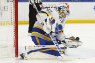 Buffalo Sabres goalie Carter Hutton (40) makes a glove save during the first period of an NHL hockey game against the Philadelphia Flyers, Saturday, Feb. 27, 2021, in Buffalo, N.Y. (AP Photo/Jeffrey T. Barnes)