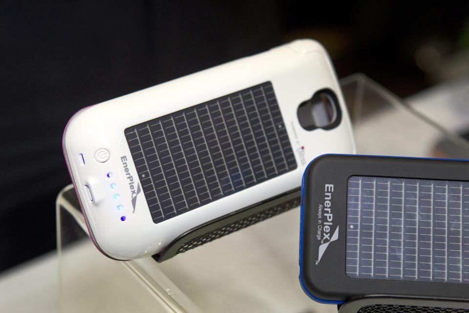 Smartphone cases with solar photovoltaic cells by EnerPlex are displayed during "CES Unveiled," a media preview event to the annual Consumer Electronics Show (CES), in Las Vegas, Nevada, January 5, 2014. The cases retail for $89.99-$99.99 depending on the model. (REUTERS/Steve Marcus)