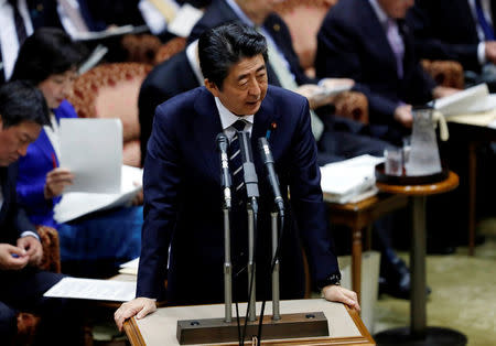 FILE PHOTO: Japan's Prime Minister Shinzo Abe answers a question during an upper house parliamentary session in Tokyo, Japan March 28, 2018. REUTERS/Issei Kato/File Photo