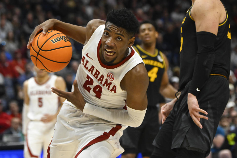 FILE - Alabama forward Brandon Miller, left, drives into the lane during the second half of an NCAA college basketball game against Missouri in the semifinals of the Southeastern Conference Tournament, March 11, 2023, in Nashville, Tenn. Miller is among the top forwards in the upcoming NBA draft. (AP Photo/John Amis, File)