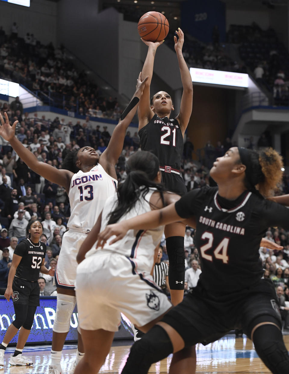 South Carolina's Mikiah Herbert Harrigan (21) makes a basket as Connecticut's Christyn Williams (13) defends during the first half of an NCAA college basketball game, Monday, Feb. 11, 2019, in Hartford, Conn. (AP Photo/Jessica Hill)