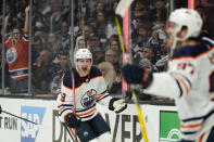 Edmonton Oilers left wing Zach Hyman, left, celebrates his power play goal with center Connor McDavid during the first period in Game 3 of an NHL hockey Stanley Cup first-round playoff series against the Los Angeles Kings Friday, May 6, 2022, in Los Angeles. (AP Photo/Mark J. Terrill)