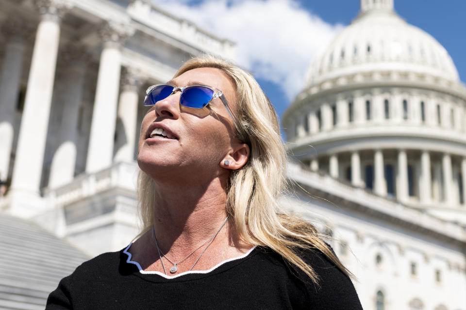 UNITED STATES - MAY 14: Rep. Marjorie Taylor Greene, R-Ga., speaks to reporters about her recent interaction with Alexandria Ocasio-Cortez, D-N.Y., as she leaves the Capitol after the last vote of the week on Friday, May 14, 2021. (Photo by Bill Clark/CQ-Roll Call, Inc via Getty Images)