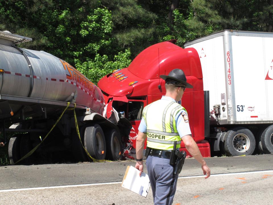 A Georgia state trooper works the scene of a deadly crash in Ellabelle, Ga.