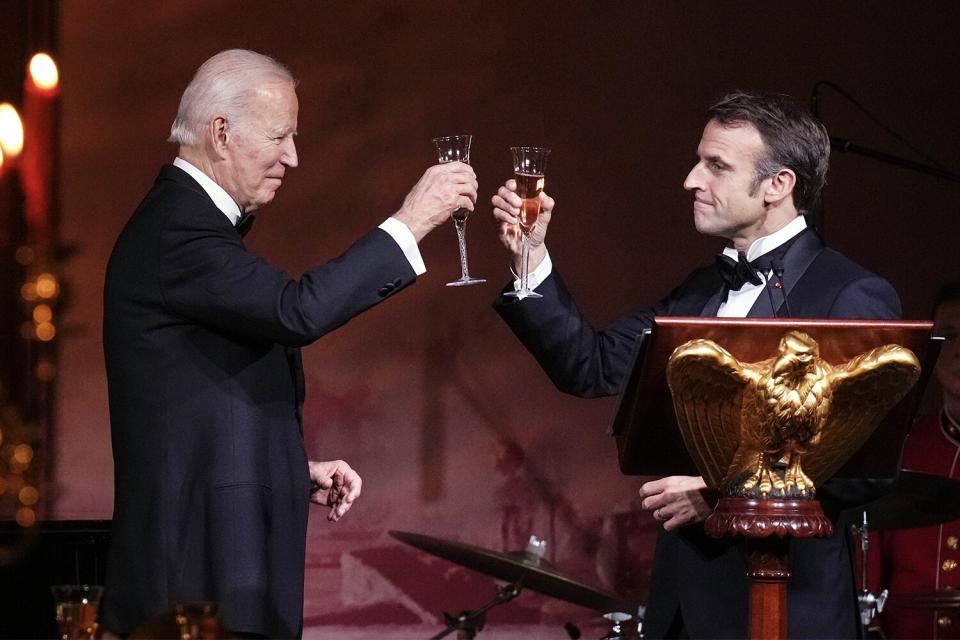 WASHINGTON, DC - DECEMBER 1: U.S. President Joe Biden and French President Emmanuel Macron make a toast after speaking at the state dinner on the South Lawn of the White House on December 1, 2022 in Washington, DC. President Biden is hosting Macron for the first official state visit of the Biden administration. (Photo by Drew Angerer/Getty Images)