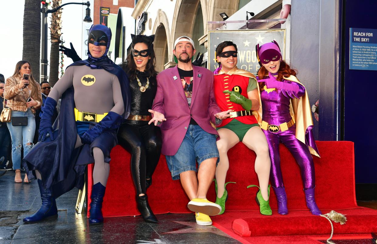 Director/actor Kevin Smith (C) poses with characters dressed in costume at Burt Ward's Hollywood Walk of Fame Star ceremony on January 9, 2020 in Hollywood, California - The actor who played Robin in the 
