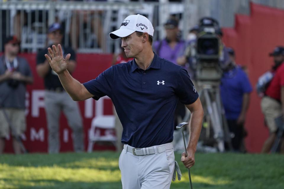 Maverick McNealy waves after making an eagle putt on the 18th green of the Silverado Resort North Course during the final round of the Fortinet Championship PGA golf tournament Sunday, Sept. 19, 2021, in Napa, Calif. McNealy finished second in the tournament. (AP Photo/Eric Risberg)