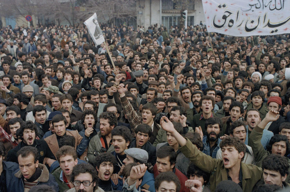 FILE - In this Oct. 9, 1978 file photo, demonstrators protest Shah Mohammad Reza Pahlavi in Tehran, Iran. Forty years ago, Iran's ruling shah left his nation for the last time and an Islamic Revolution overthrew the vestiges of his caretaker government. The effects of the 1979 revolution, including the takeover of the U.S. Embassy in Tehran and ensuing hostage crisis, reverberate through decades of tense relations between Iran and America. (AP Photo/Michel Lipchitz, File)