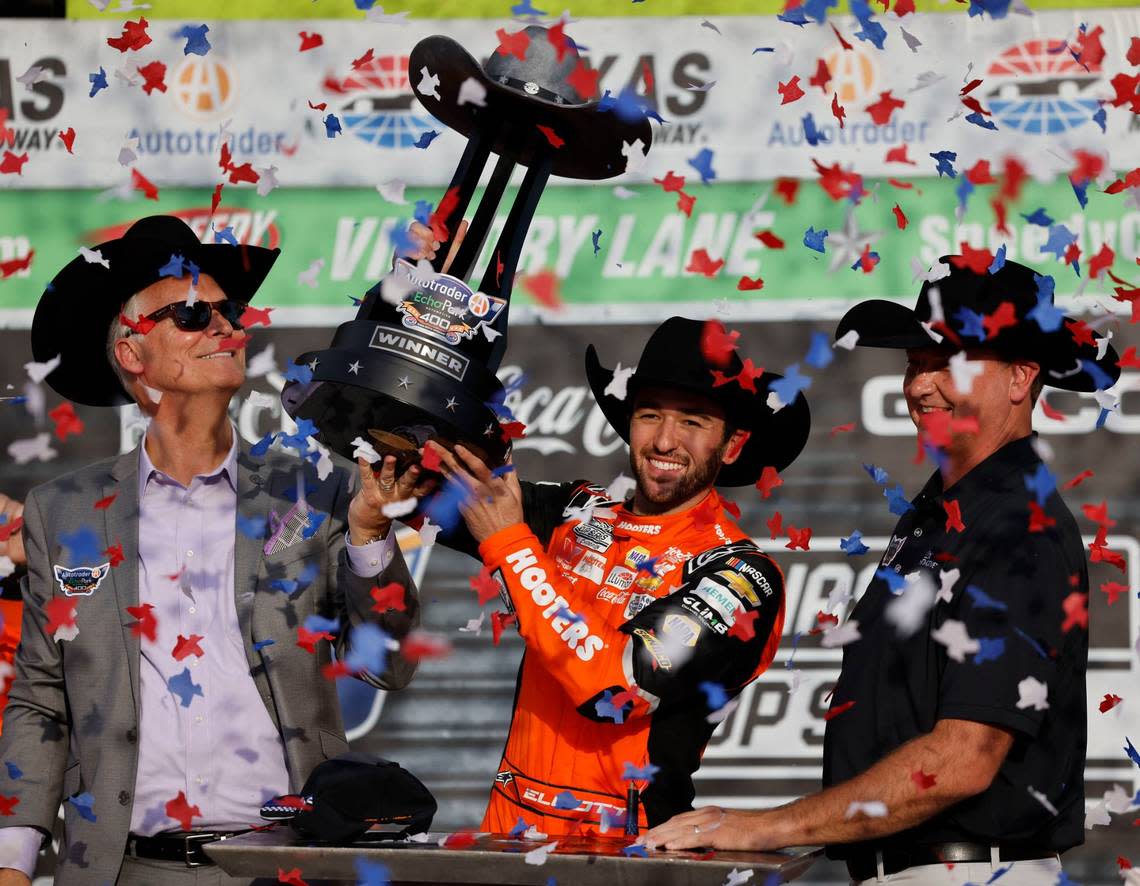 Chase Elliott (9) hoists the trophy after winning the Auto Trader Echo Park 400 at Texas Motor Speedway in Fort Worth, Texas, April 14, 2024. Kyle Larson won stage 1. (Special to the Star-Telegram/Bob Booth) Bob Booth/(Special to the Star-Telegram)