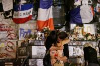 People mourn in Paris after a priest was killed in the Normandy city of Saint-Etienne-du-Rouvray in the latest of a string of attacks claimed by or blamed on IS, on July 26, 2016