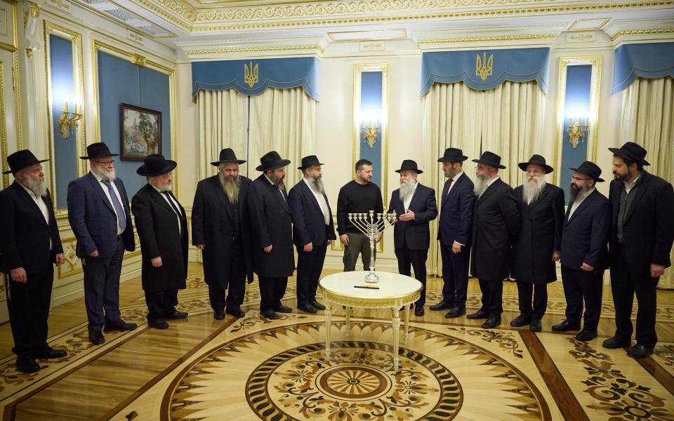 Volodymyr Zelensky lighting candles with the representatives of the Ukrainian Jewish clergy to celebrate Hanukkah