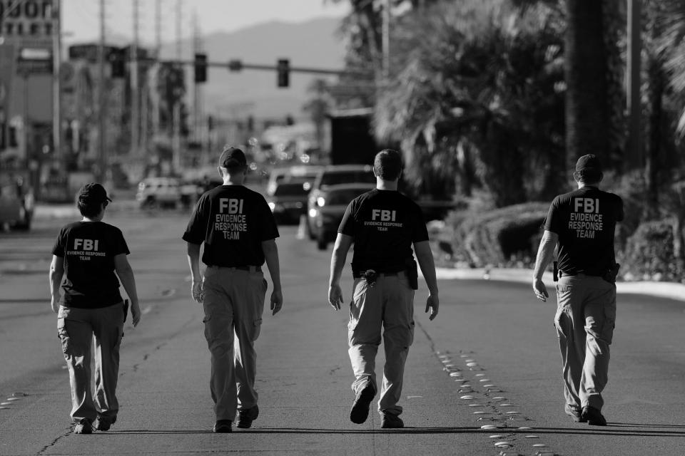 An FBI evidence response team on Oct. 3 looks over the crime scene following the mass shooting at the Route 91 Harvest Country Music Festival on the Las Vegas Strip. (Digitally enhanced photo: Mike Blake/Reuters)