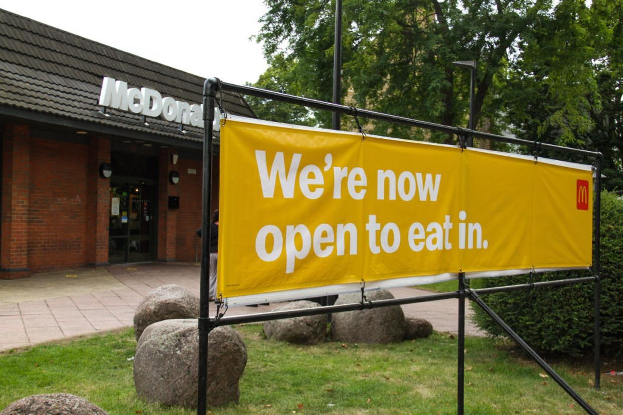 <span class="caption">Open to eat indoors – but will you?</span> <span class="attribution"><a class="link " href="https://www.gettyimages.com/detail/news-photo/banner-bearing-the-words-were-now-open-to-eat-in-seen-at-a-news-photo/1227801524?adppopup=true" rel="nofollow noopener" target="_blank" data-ylk="slk:David Mbiyu/SOPA Images/LightRocket via Getty Images;elm:context_link;itc:0;sec:content-canvas">David Mbiyu/SOPA Images/LightRocket via Getty Images</a></span>