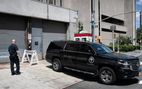 A medical examiner car is seen outside New York Presbyterian-Lower Manhattan Hospital,  - Credit: Reuters