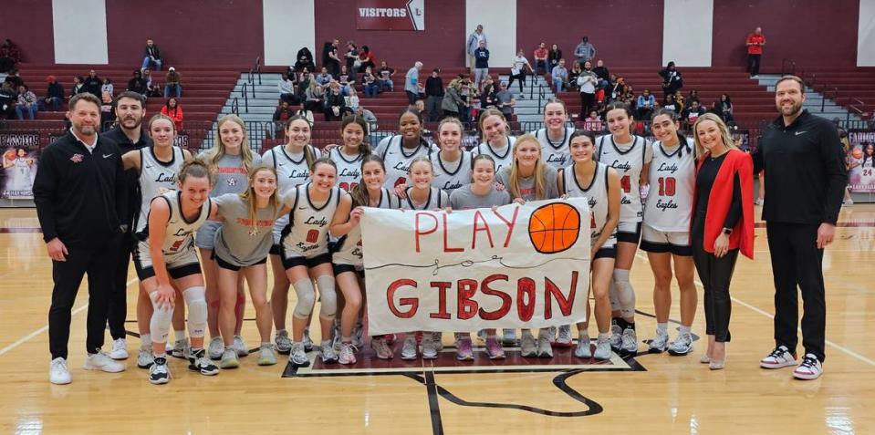 The Argyle girls basketball team poses after defeating Colleyville Heritage 65-32 in a Class 5A Region I quarterfinal on Monday, February 19, 2024 at Lewisville High School in Lewisville, Texas.