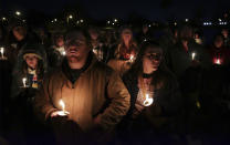 People attend a candlelight vigil for Tyre Nichols, who died after being beaten by Memphis police officers, in Memphis, Tenn., Thursday, Jan. 26, 2023. (Patrick Lantrip/Daily Memphian via AP)