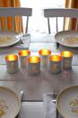 <p>Votive candle holders that spell out sentimental words like "thanks" are an easy way to make your Thanksgiving table more inviting. </p><p><em><a href="http://www.abeautifulmess.com/2014/11/tin-punched-votive-candles.html" rel="nofollow noopener" target="_blank" data-ylk="slk:Get the tutorial at a Beautiful Mess »;elm:context_link;itc:0;sec:content-canvas" class="link ">Get the tutorial at a Beautiful Mess »</a></em></p>