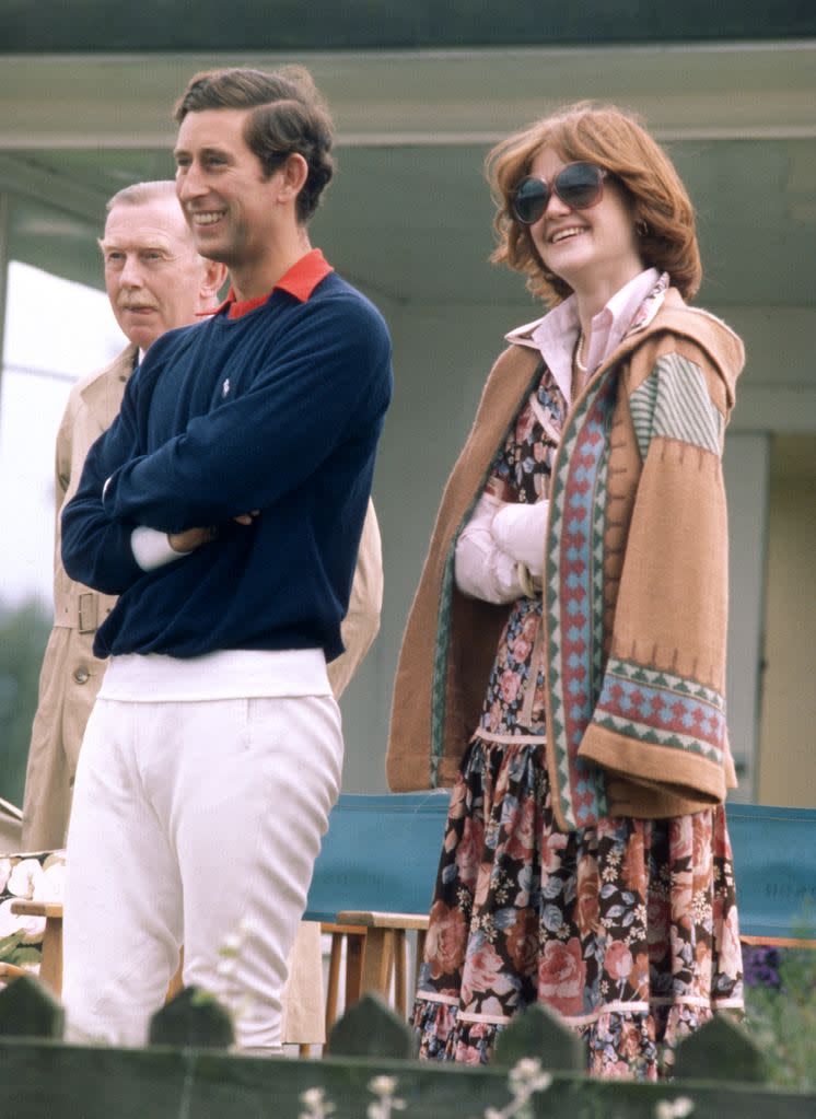 Prince Charles stands next to his then-girlfriend and sister of Lady Diana Spencer, Lady Sarah Spencer